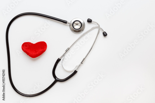 concept of life stethoscope on white background with plush heart