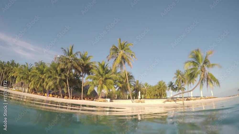 Exotic Maldives island in the middle of turquoise Indian ocean Exotic Maldives island in the middle of turquoise Indian ocean