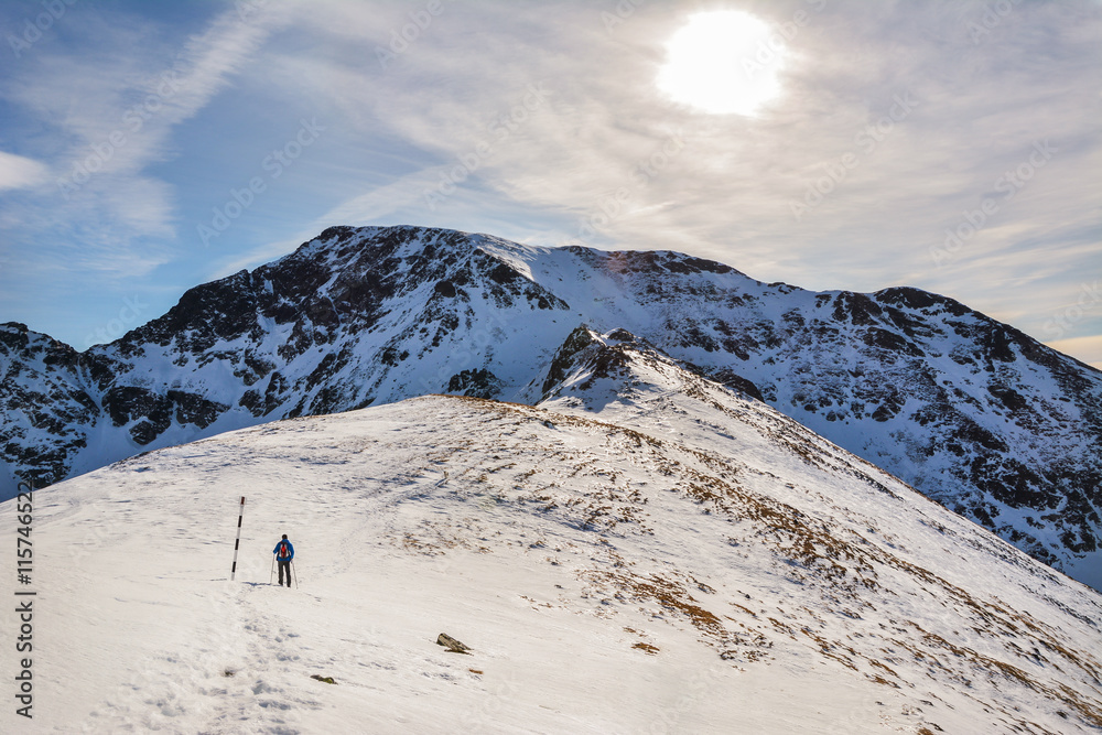 Extreme Sport. Lone hikers in winter in romanian carpathian mountains