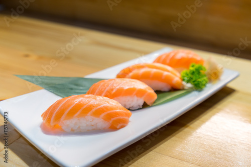 Salmon sushi, Japanese food delicious menu, served on wooden counter table
