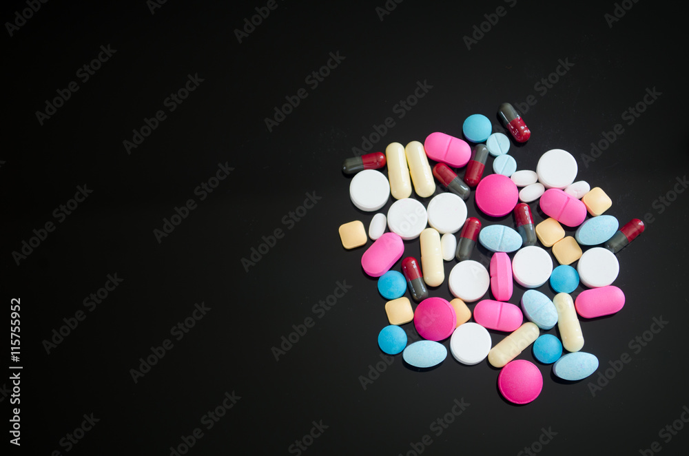 Pharmacy background on a wood table.Pills. Medicine and healthy. Close up of capsules. Different kind of medicines Pharmacy background on a wood table.Pills. Medicine and healthy. Close up of capsules. Different kind of medicines