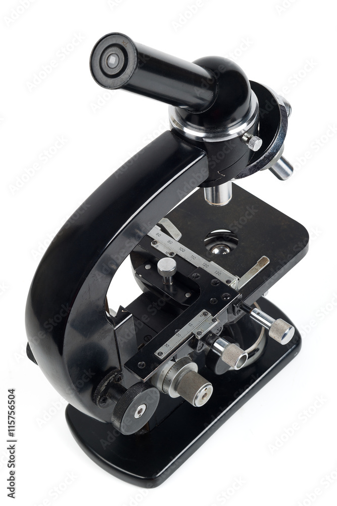 Old microscope isolated on white. Old microscope isolated on white.