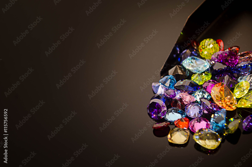 Jewel on black shine color, Collection of many different natural gemstones 
amethyst, lapis lazuli, rose quartz, citrine, ruby, amazonite, moonstone, labradorite, chalcedony, blue topaz