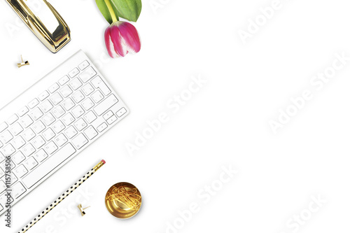 Office desk and woman objects on white table. Flat lay. Tulip , gold stapler, pencil. Table view. Still life of fashion