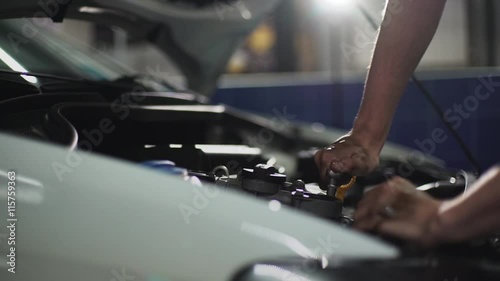 Auto mechanic repair engine in a car repair shop