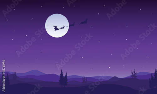 Silhouette of santa sleigh flying at night