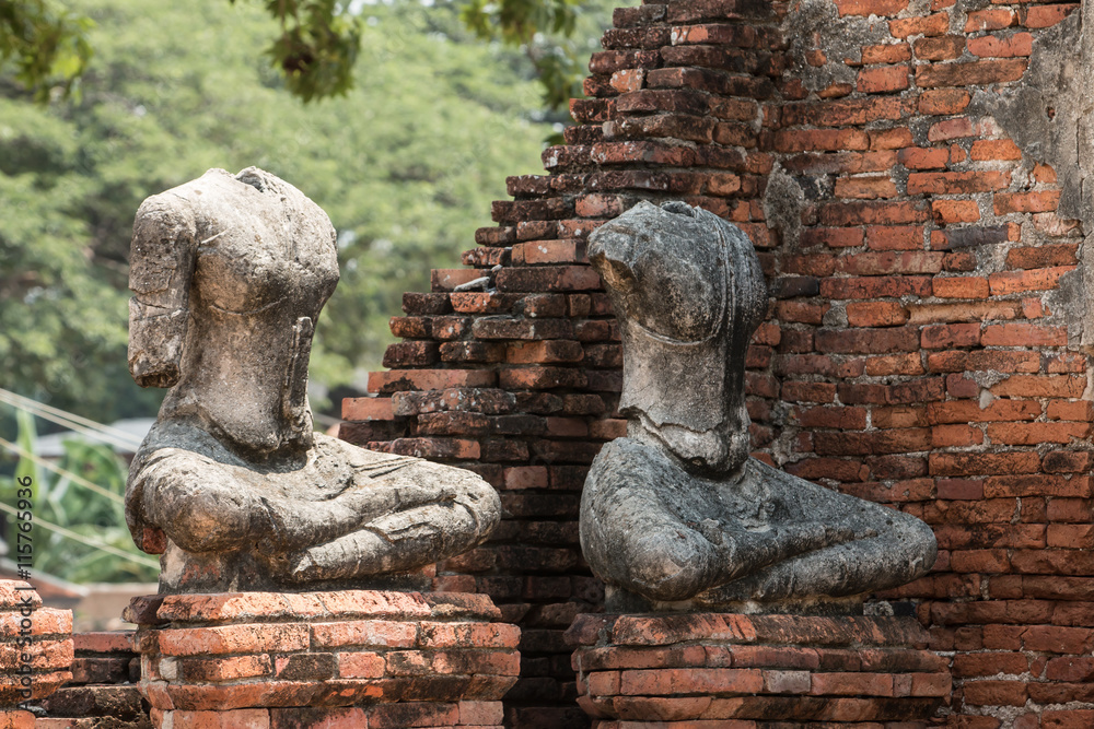 row of ruin buddha statue in wat chai wattanaram, ayutthaya, tha