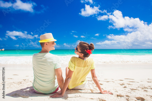 Couple in bright clothes having fun at tropical beach © el.rudakova