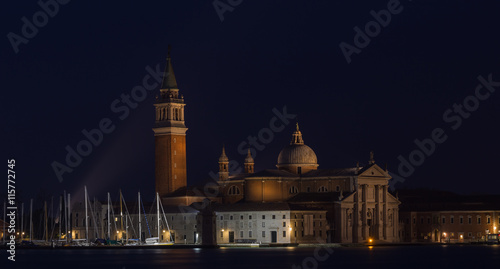 VENICE, ITALY - JANUARY 2, 2016: Streetlight on the background of the Church of San Giorgio Maggiore - Venice, Italy