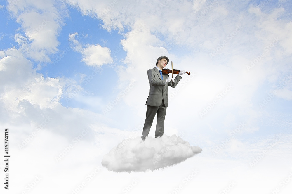 Man playing holiday melody . Mixed media Man playing holiday melody . Mixed media