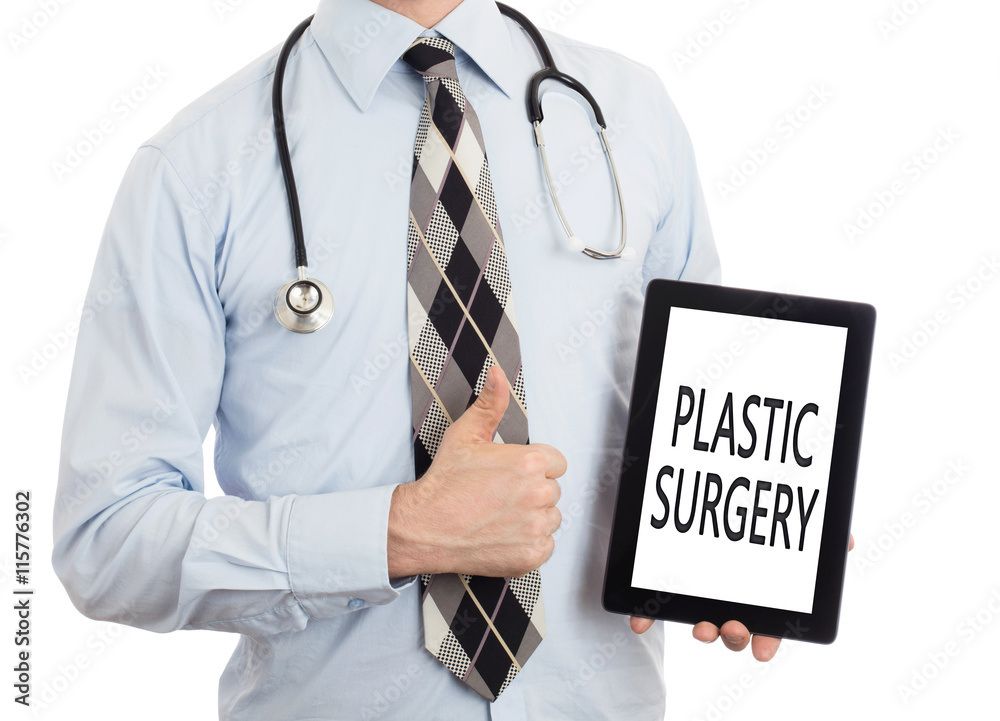 Doctor holding tablet - Plastic surgery Doctor holding tablet - Plastic surgery