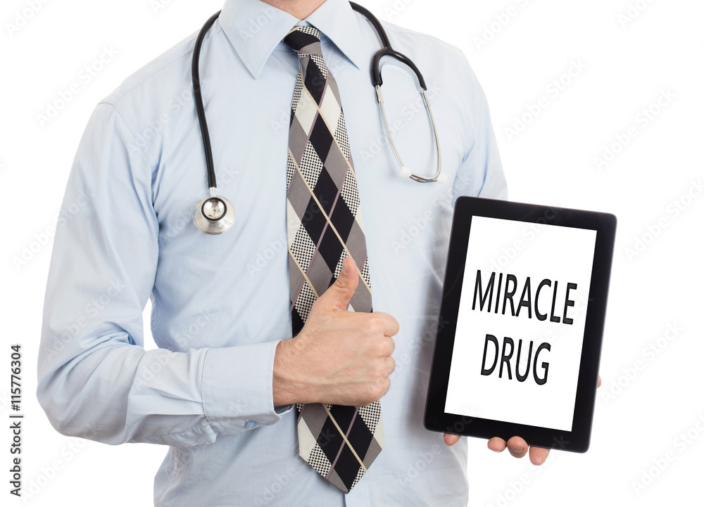 Doctor holding tablet - Miracle drug Doctor holding tablet - Miracle drug