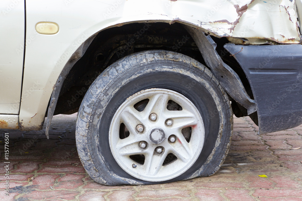 close up shot of flat tire waiting for repair