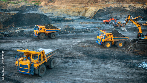 Excavators on a construction site working on coal. General construction scene
