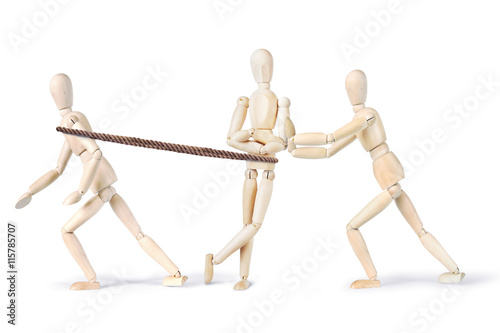 Foto Two people pull another one to make him move