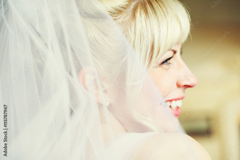Bride smiles sparkling looking over her shoulder Bride smiles sparkling looking over her shoulder