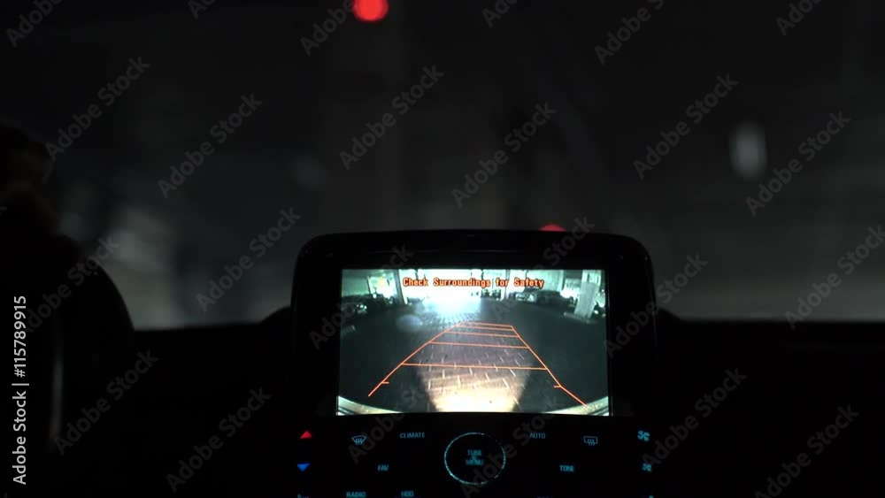 A car's backup camera in action at parking space in a mall