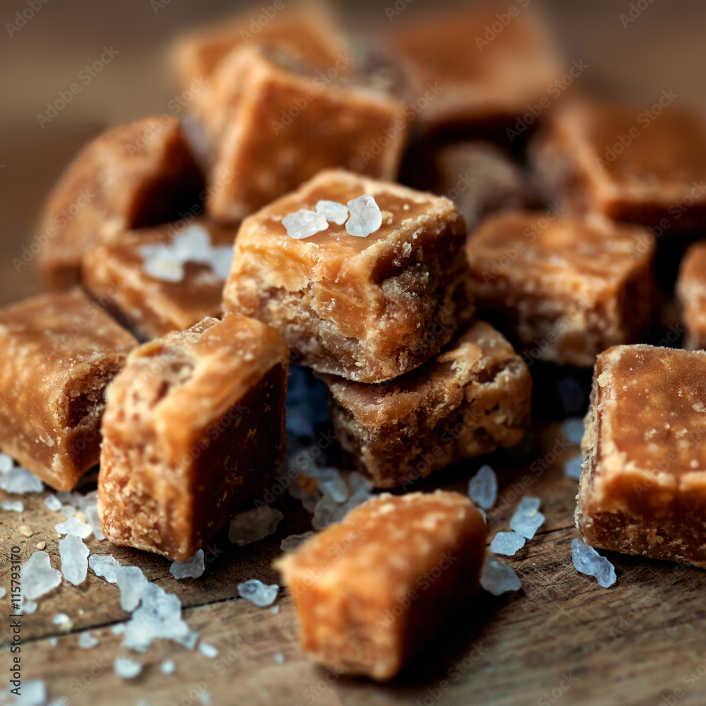 Salted caramel pieces and sea salt macro. Butter caramel candy m Salted caramel pieces and sea salt macro. Butter caramel candy m