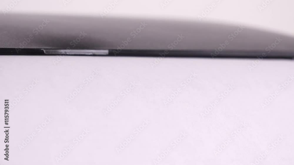 Office desktop laser printer output tray, single A4 letter printed page coming out Office desktop laser printer output tray, single A4 letter printed page coming out
