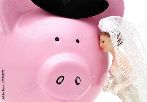 Fototapet A woman sees her husband as a piggy bank