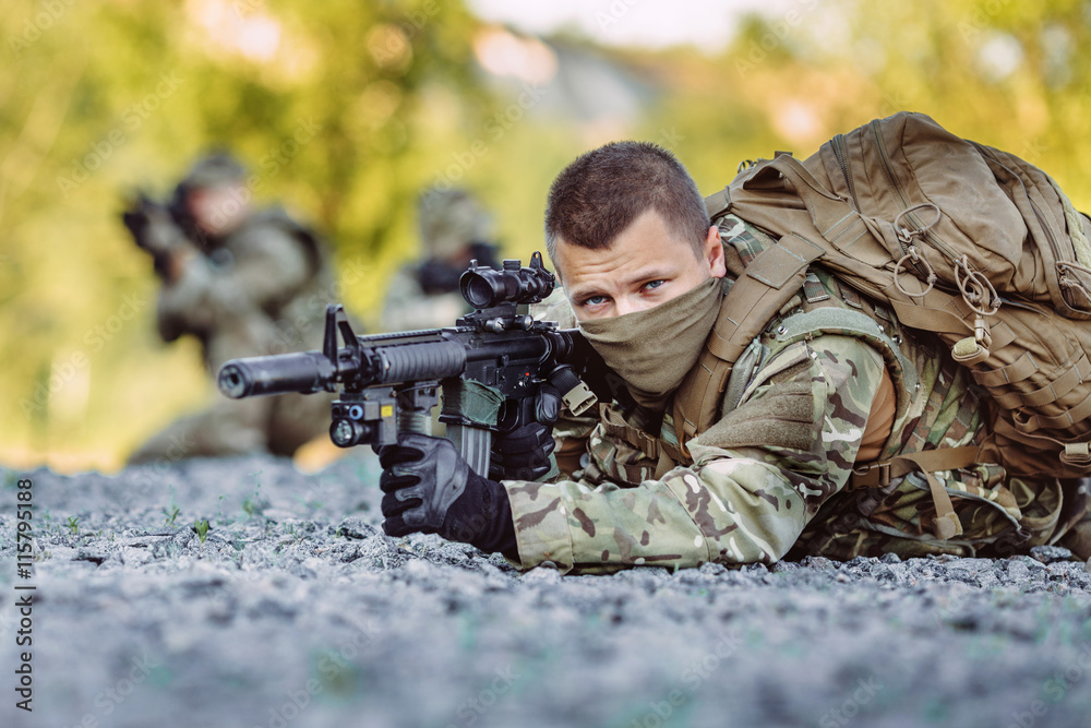 Fototapeta premium Special forces soldiers with weapon take part in military maneuv
