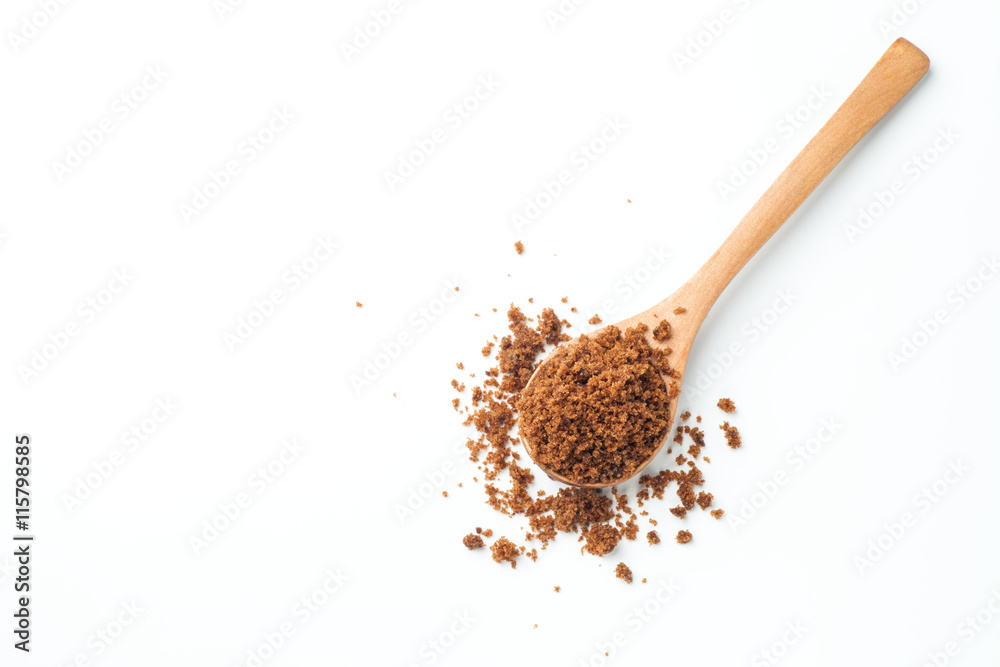 brown sugar with wooden spoon on white background brown sugar with wooden spoon on white background