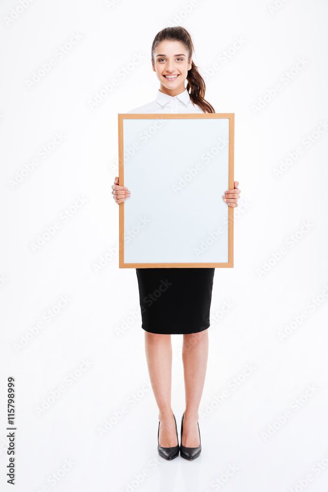 Young smiling businesswoman holding blank board Young smiling businesswoman holding blank board
