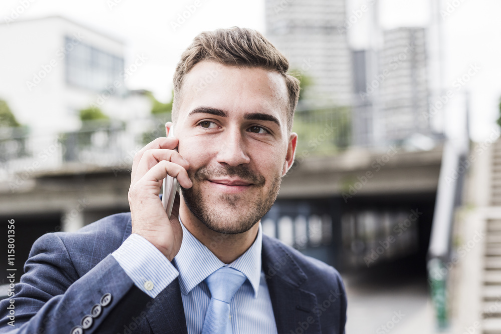 Portrait of a young businessman talking on the phone Portrait of a young businessman talking on the phone