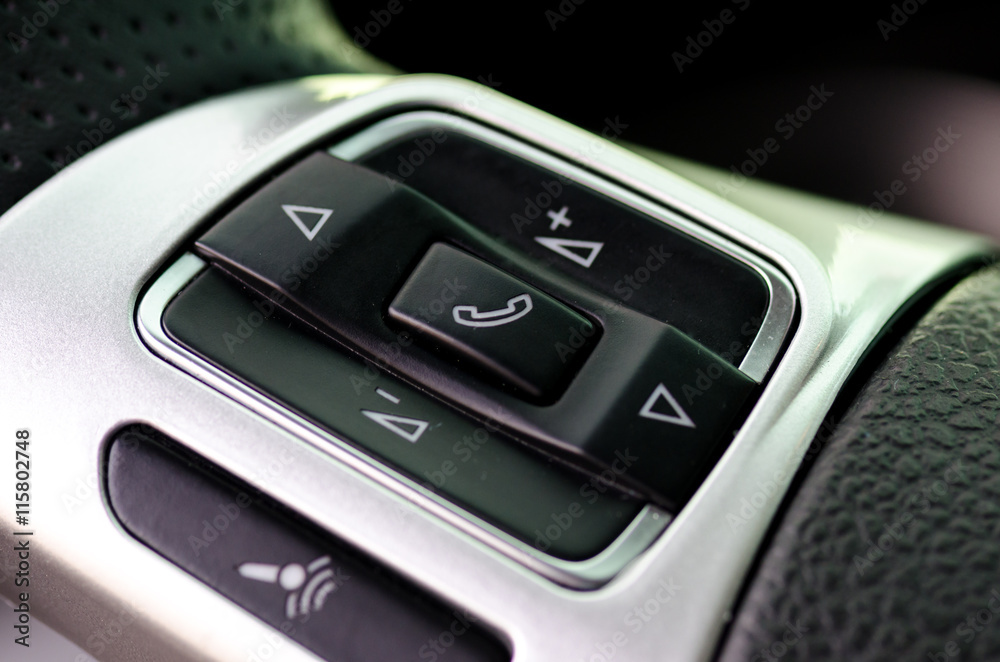 Car control keys for radio volume on leather steering wheel of m