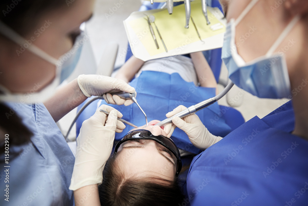 female dentists treating patient girl teeth female dentists treating patient girl teeth