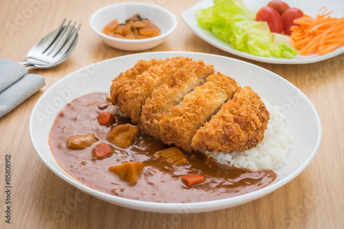 Crispy fried pork cutlet with curry and rice, Japanese food style photo