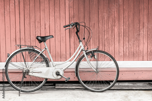 Bicycle vintage wood wall background.