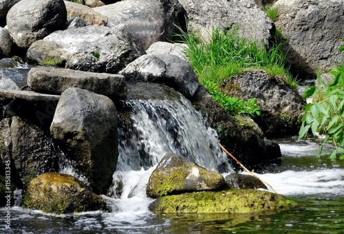 Rapids between rocks at the mountain river  