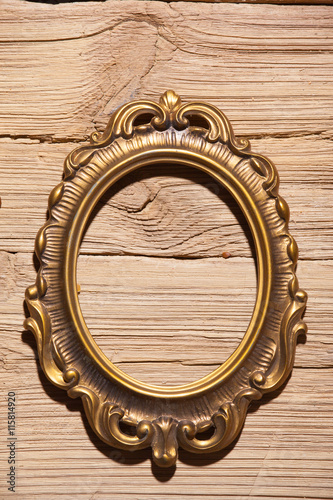 golden frame on wood texture background