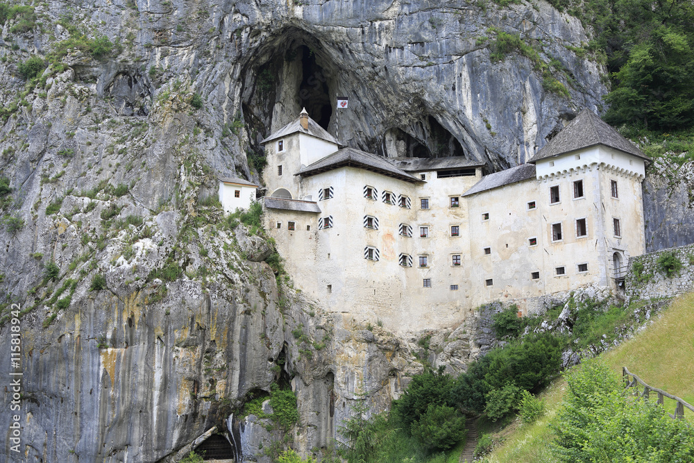  View of the Predjama Castle, a renaissance castle partly built within a cave mouth and now serves as a famous tourist destination in Postojna, Slovenia.