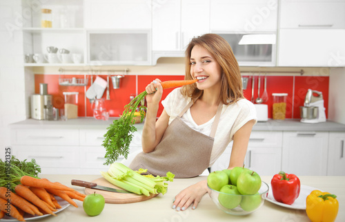 Beautiful girl eating carro...
