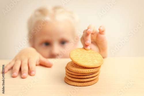 Funny little girl hiding be...
