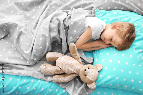 Adorable little boy sleepin...