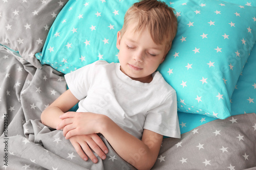 Adorable little boy sleepin...
