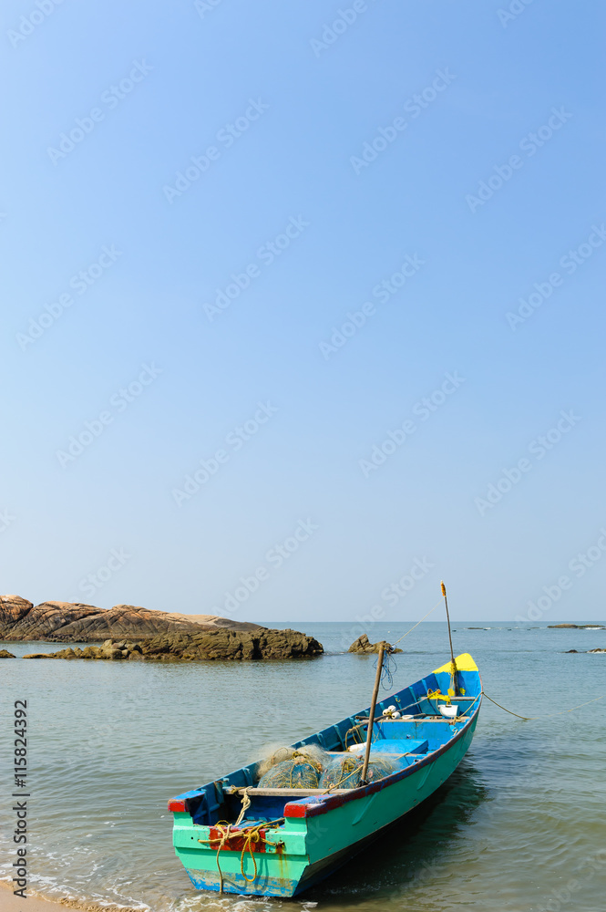Old fisherman boats at beautiful tropical beach. India