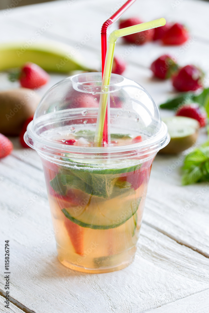 fresh lemonade with strawberries , lime and mint