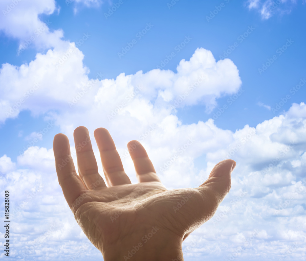 Opened hand raised to heaven in waiting for something. Depth of field with focus on palm. Clipping path included. Opened hand raised to heaven in waiting for something. Depth of field with focus on palm. Clipping path included.