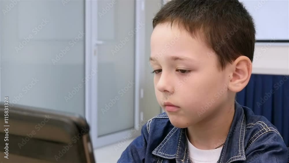 beautiful boy playing the tablet, slow motion beautiful boy playing the tablet, slow motion