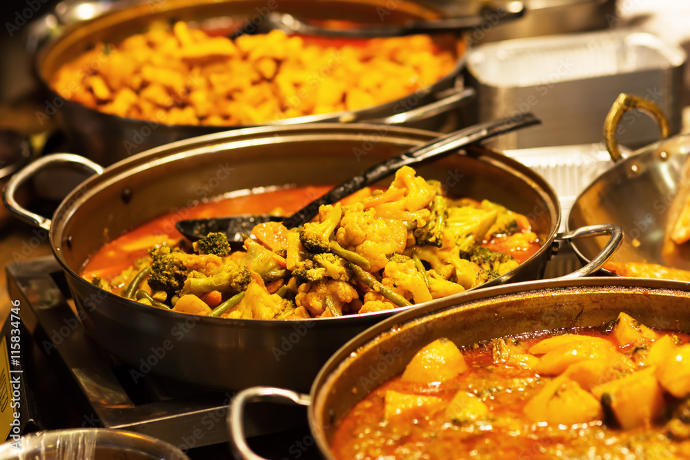 pans with vegetable stew at a food market pans with vegetable stew at a food market