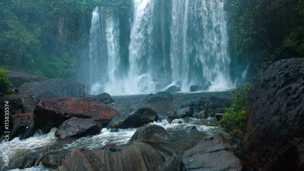 Veil of White Water Tumbles over the Brink of a Natural Park at Phnom Kulen in Cambodia, with Sound. UltraHD video