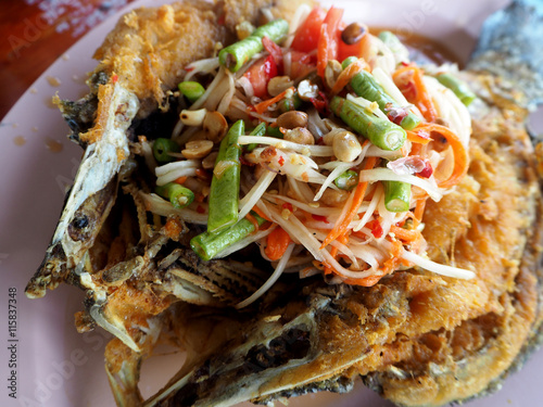 Fried snapper fish with papaya salad