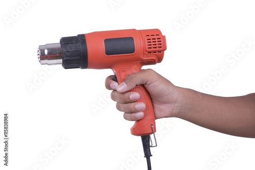 Hand hold hot air blower on white background