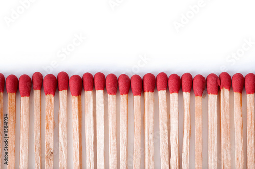 Close-up of red matches on white background