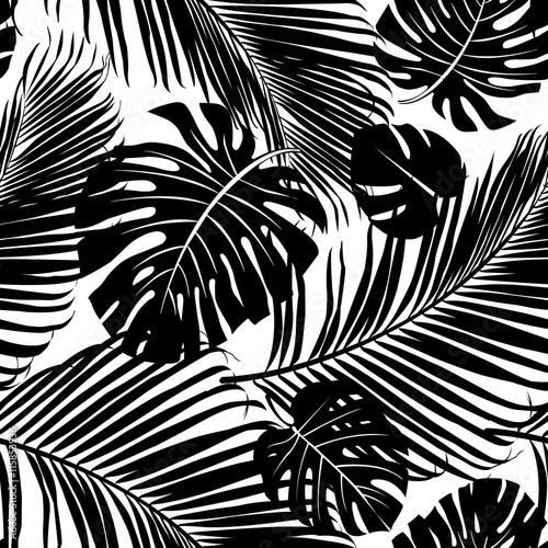 Seamless repeating pattern with silhouettes of palm tree leaves in black on white background.