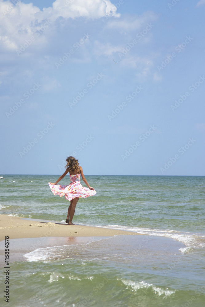 happy and beautiful young woman on sea coast happy and beautiful young woman on sea coast